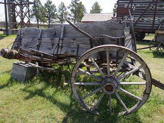 Fototapeta premium Close up of a dilapidated wooden wagon cart displayed in an 1880s town in South Dakota.