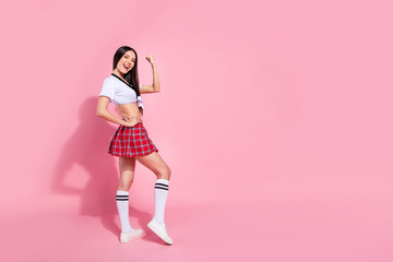 Full length body size profile side view of her she nice-looking attractive graceful sporty slender cheerful cheery glad straight-haired lady satisfaction isolated on pink pastel background