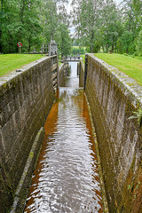 straight water channel with several locks in Sweden