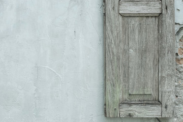 wall with window and wooden window