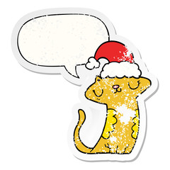 cute cartoon cat wearing christmas hat and speech bubble distressed sticker