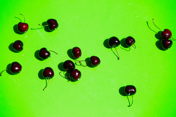 Cherries are confused, green background