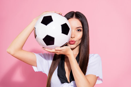 Close up photo of beautiful lady head school committee soccer ball hands hiding half face coquette wear white top isolated pink background