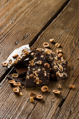 hazelnut dark chocolate pieces on wooden table