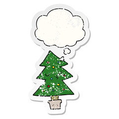 cartoon christmas tree and thought bubble as a distressed worn sticker