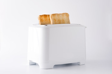 Toasted toast bread in white toaster isolated on white background