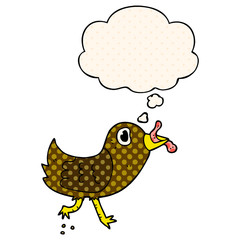 cartoon bird with worm and thought bubble in comic book style