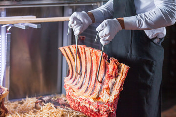 Display of Dry Aged Meat Steaks in butchers shop or restaurant in an display refrigerator.
