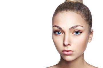 Fototapeta premium Portrait of young beautiful girl with long blond hair and natural make-up