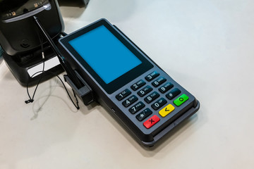 The digital high performance PIN pad with rich multimedia and commerce capabilities on white table © v74