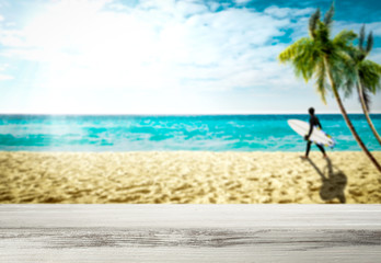 desk of free space and beach background 