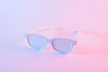 White eye glasses against pink background