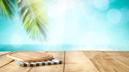 desk of free space and beach background 