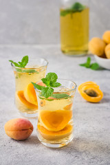 Summer drink, apricot mint tea. Selective focus, space for text.