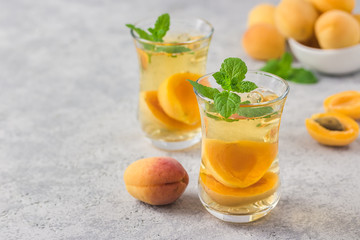 Summer drink, apricot mint tea. Selective focus, space for text.