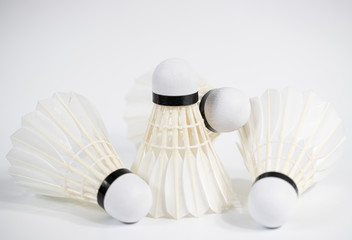 Fototapeta na wymiar white badminton shuttlecocks lay on white table background