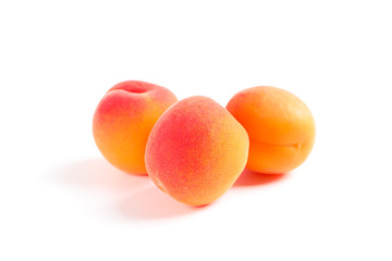 Fresh sweet apricots isolated on white background