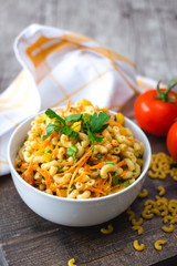 Pasta Salad with vegetable in a white bowl 