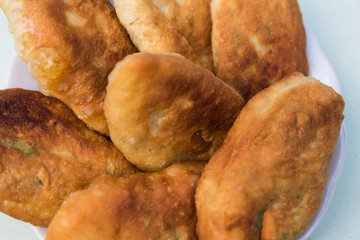 fried pastries set on a plate, close-up