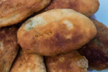 fried pastries set on a plate, close-up