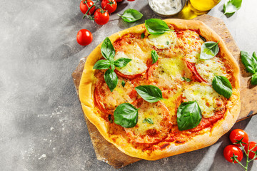Homemade pizza with mozzarella on grey background