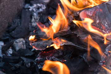 fire and black charcoal in a grill