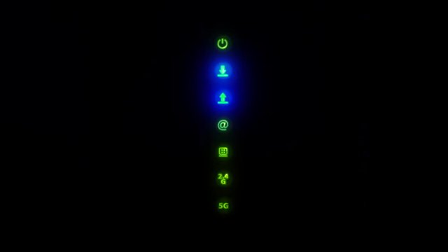 Wi-Fi route, wireless home internet modem indicators led lights of the connection. Signals blink on modem. 4K