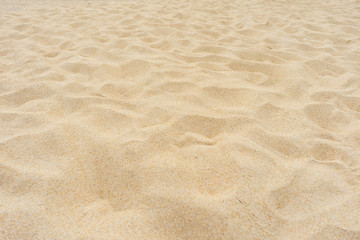 Naklejka na ściany i meble Yellow beach sand texture.