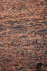 Red brick building wall in Krakow old town, Poland