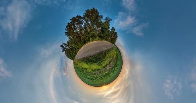 NO VR. Curvature of space of little planet transformation. Abstract torsion and spinning of full flyby panorama landscape in field in sunny evening with awesome clouds.