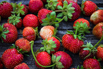 Fresh strawberries on an old wooden table