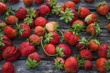 Fresh strawberries on an old wooden table