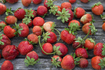 Fresh strawberries on an old wooden table