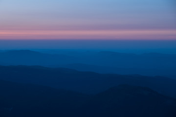 mountain expanses in the clouds at sunset