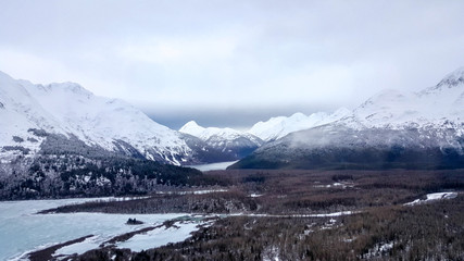 Helicopter flying over Alaska glacier