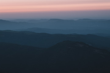 mountain expanses in the clouds at sunset