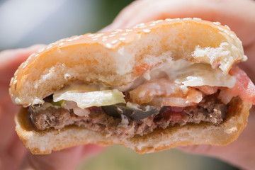 Bitten hamburger close-up.