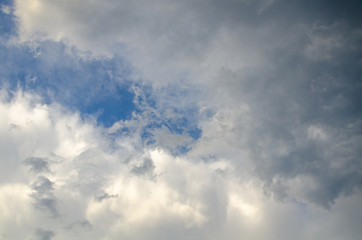 Dramatic cloudscape background with gray cumulus clouds on sky