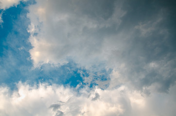 Dramatic cloudscape background with gray cumulus clouds on sky