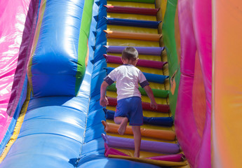 Fototapeta na wymiar little boy on a slide
