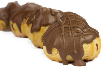 Traditional type of Brazilian profiterolis bakery candy called carolina in white background