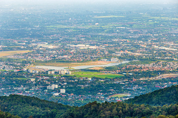 view in the mountains with cityscape over the city of Chiang Mai, Thailand at daytime.