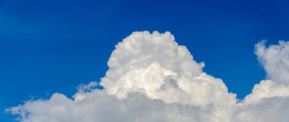 Panorama of blue sky with white cumulus clouds
