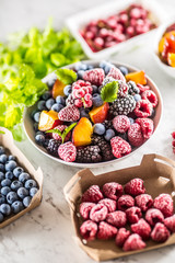 Frozen fruits blueberries blackberry raspberry red currant peach and herbs melissa