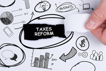 Business, technology, internet and networking concept. Young entrepreneur showing keyword: taxes...