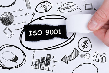 Business, technology, internet and networking concept. Young entrepreneur showing keyword: ISO 9001