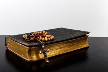 Rosary beads and prayer book.