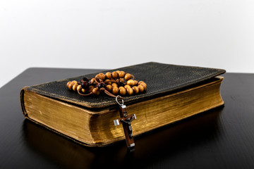 Rosary beads and prayer book.