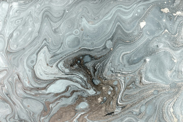 Marbling pattern. Golden powder marble liquid texture.