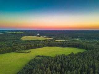 Summer warm sun light forests and fields aerial view